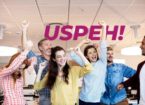 Happy creative business team celebrating success in office